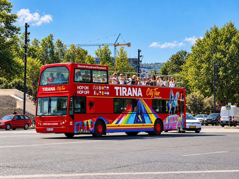 HOBUS City Tour double-decker bus driving through Tirana, Albania